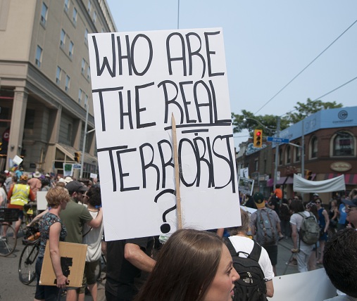 Toronto,-,July,5,:,A,Woman,Holding,A,Sign