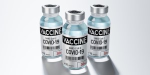 Three,Covid-19,,Sars-cov-2,,Coronavirus,Vaccine,Ampoules,Isolated,On,Grey,Background