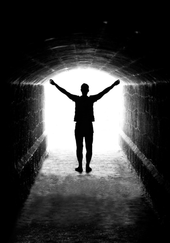 Human,Silhouette,In,Back,Lighting,In,Tunnel,Exit