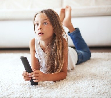 8,Years,Old,Child,Watching,Tv,Laying,Down,On,A