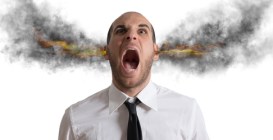 Stressed,Businessman,With,Smoke,And,Flame,In,Head