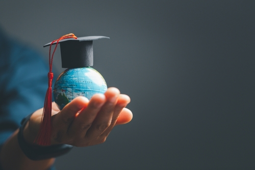 Graduation,Cap,With,Earth,Globe.,Concept,Of,Global,Business,Study,