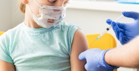Little,Girl,In,Face,Mask,In,Doctor's,Office,Is,Vaccinated.