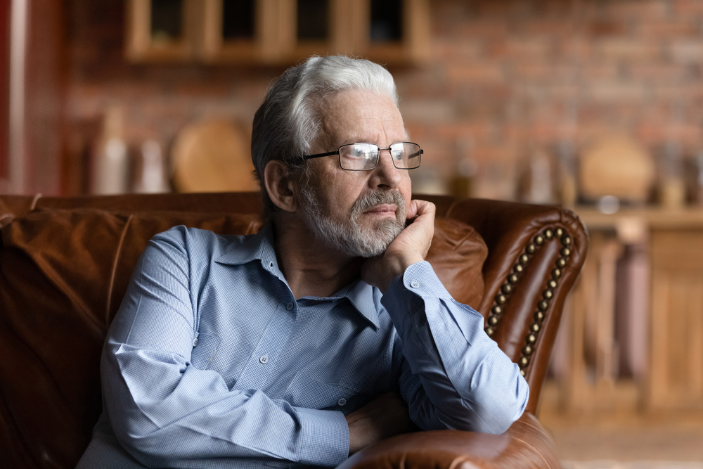 Pensive,Mature,Caucasian,Grey-haired,Man,Relax,On,Sofa,In,Living