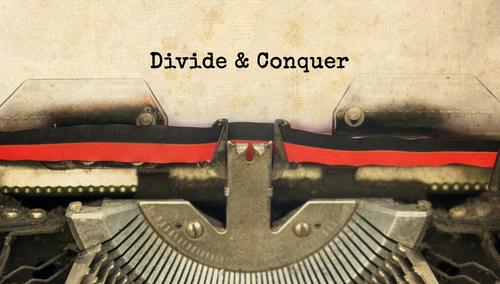 Divide,&,Conquer,Typed,Words,On,A,Vintage,Typewriter,With