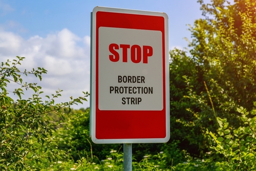 The,Inscription,Or,Text,In,English,Stop,Border,Protection,Strip.