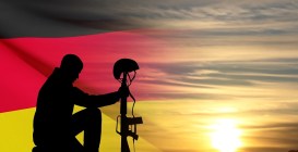 Silhouette,Of,Soldier,Kneeling,Down,On,A,Background,Of,Sunset