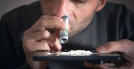 Caucasian,Man,Sniffing,Cocaine,At,Home.