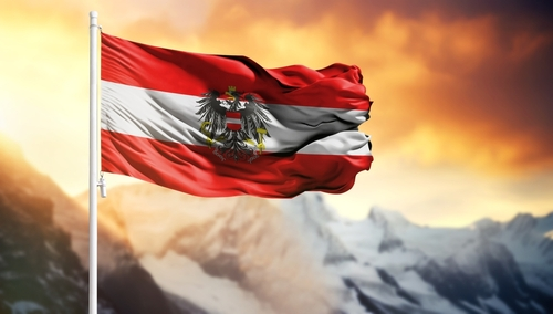 Flag,Of,Austria,On,A,Flagpole,Against,A,Colorful,Sky
