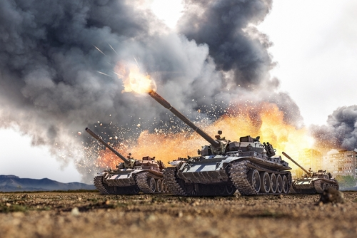Group,Of,Main,Battle,Tanks,With,A,City,On,Fire