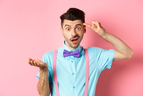 Annoyed,Guy,Mocking,Someone,Stupid,,Pointing,Finger,At,Head,And