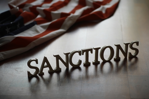 Economic,Sanctions,Concept,With,American,Flag,Background