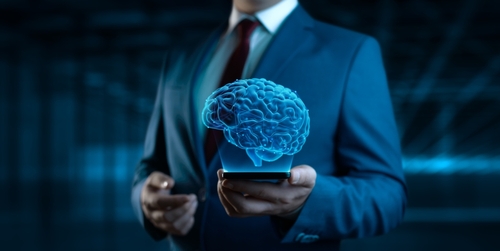 Businessman,Holding,Smartphone,Phone,With,Human,Brain,Hologram,-,Futuristic